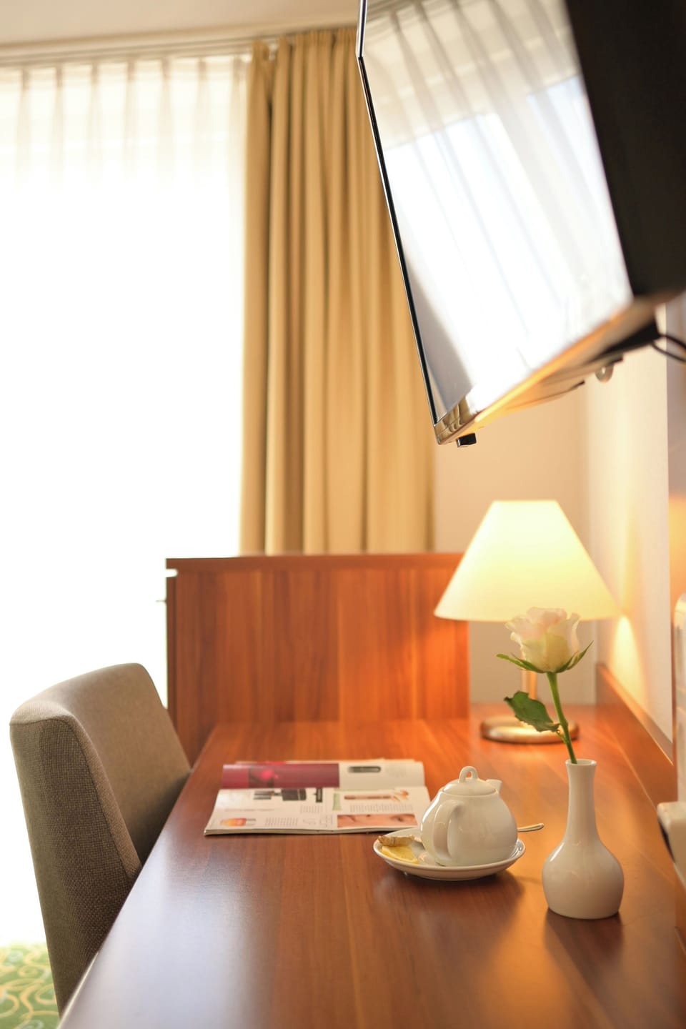 Hypo-allergenic bedding, desk, laptop workspace, blackout drapes