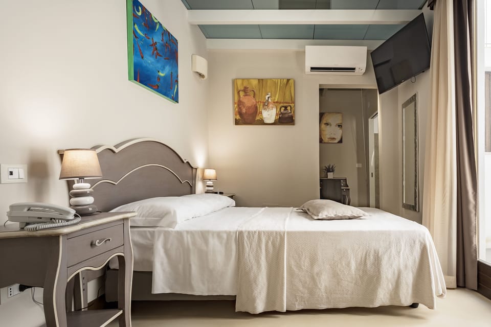 Economy Double Room (French bed ) | Minibar, in-room safe, desk, soundproofing