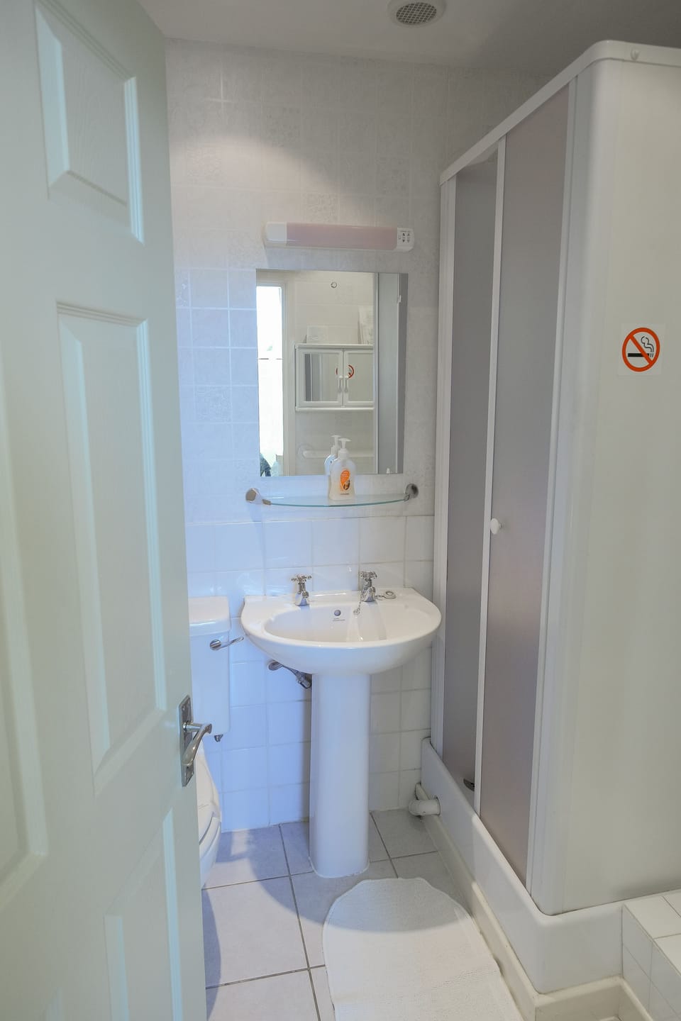 Shower, rainfall showerhead, hair dryer, towels