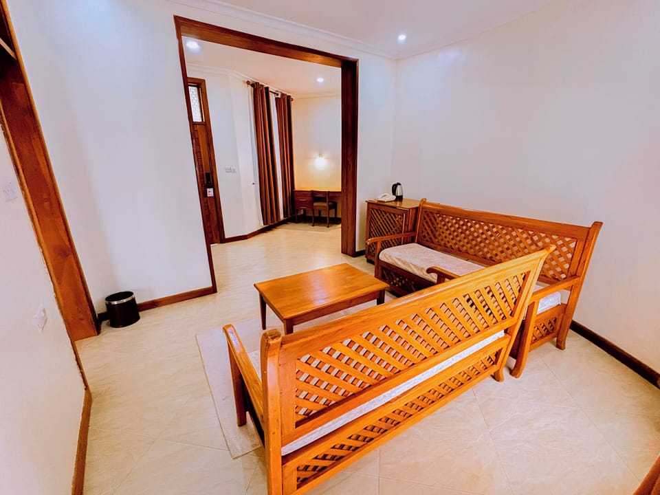 Executive Room | Living area | 32-inch LED TV with cable channels