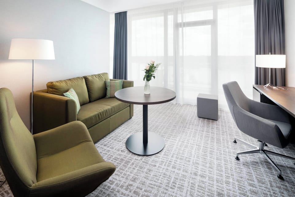 Suite, 1 King Bed, Lake View (Balcony) | Living area | LCD TV, pay movies