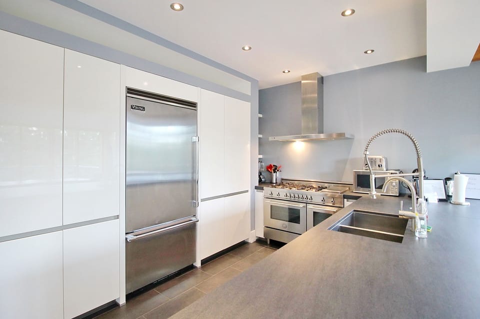 Chef’s kitchen with double oven, dual sink, dishwasher, Viking refrigerator