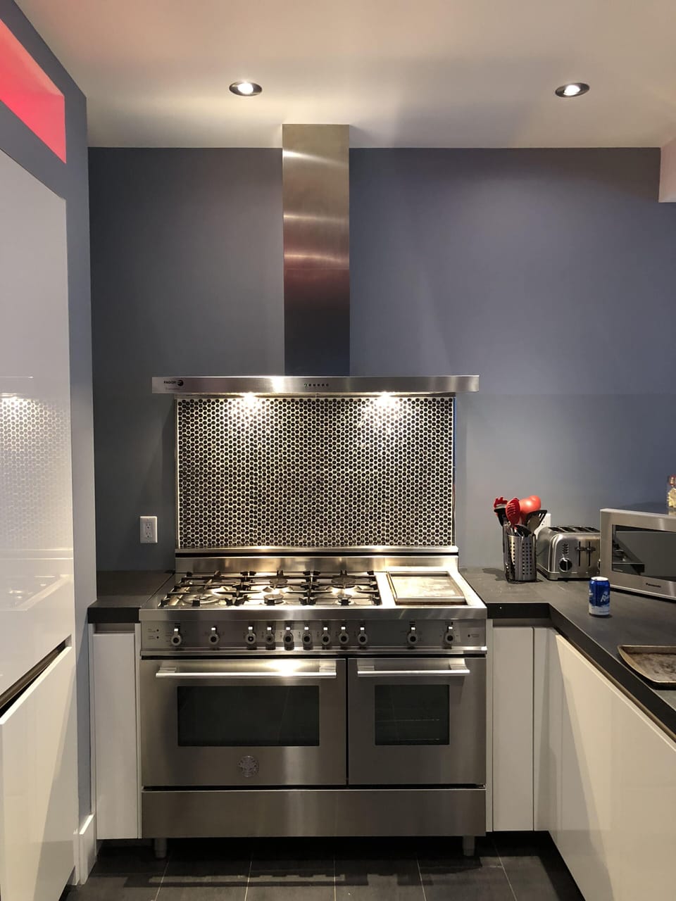 and 6-burner Bertazzoni stove, grill top and vent.