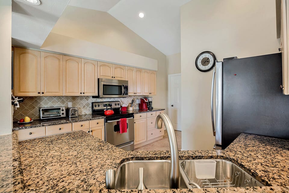 Feel at home with stainless steel kitchen appliances and granite counter tops.