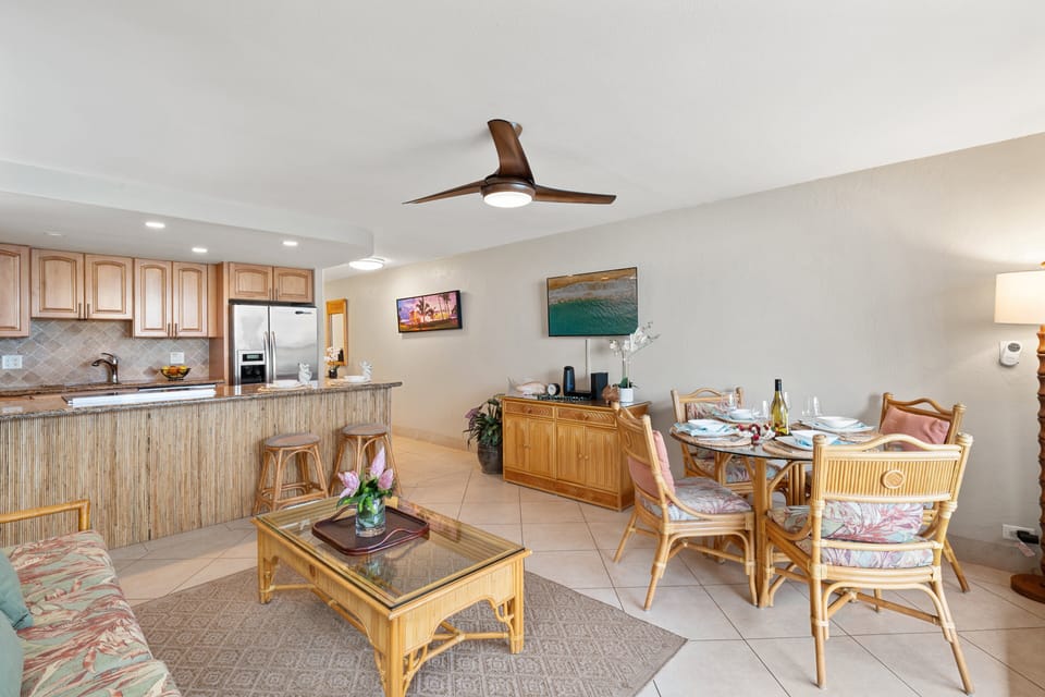 Open space with seating and dining connected to the kitchen bar.