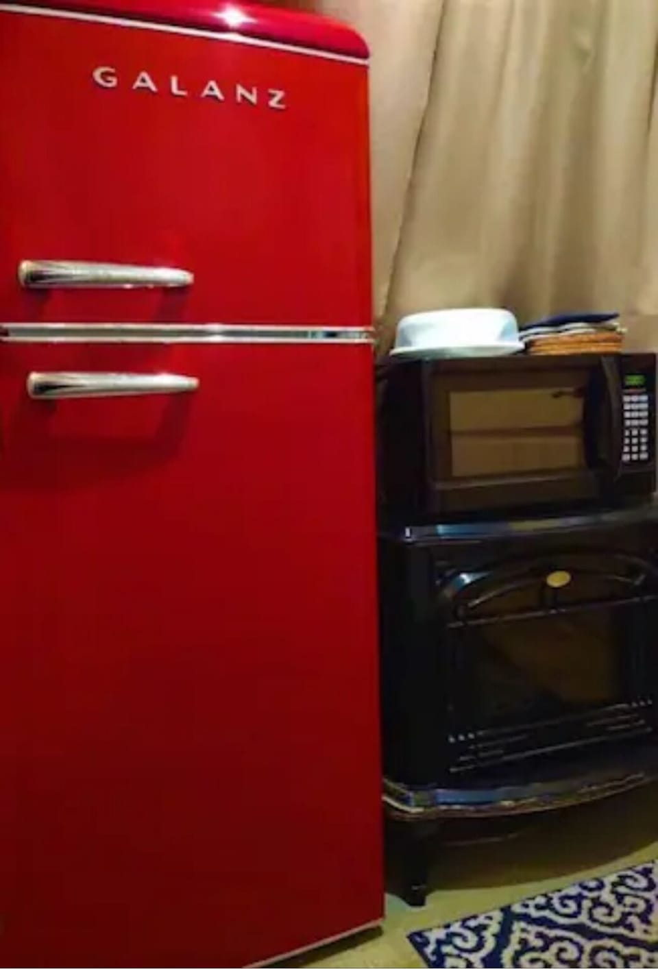 A cool red retro-look 7.5 cu ft fridge/ freezer is on board for your food items.