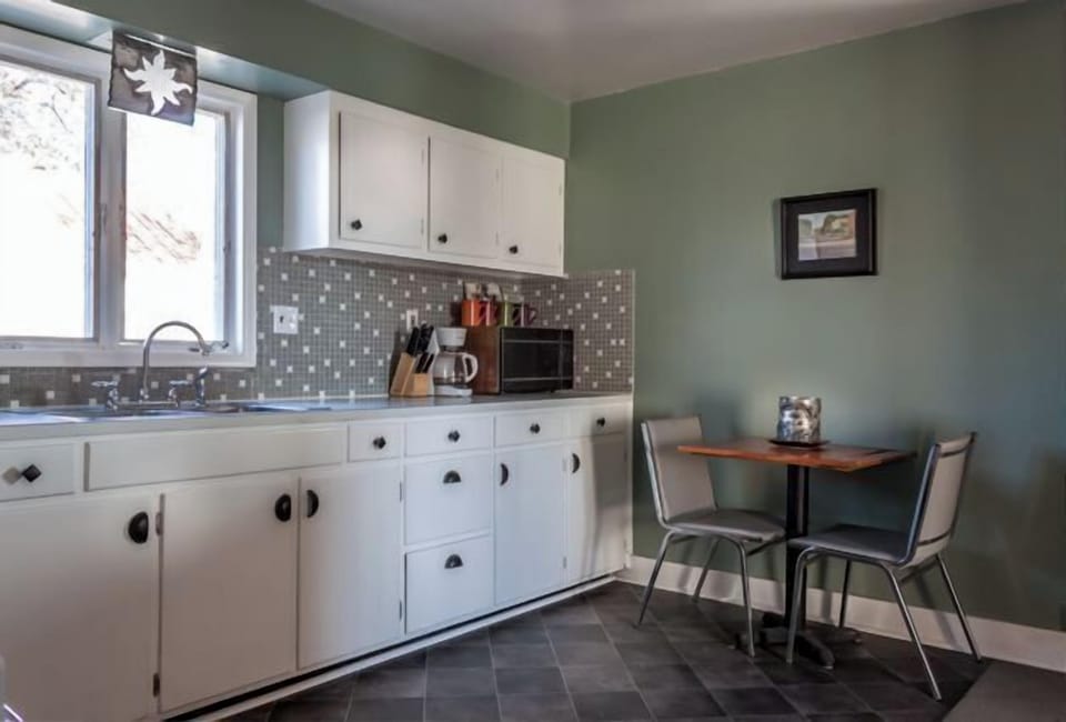 LARGE FULLY STOCKED KITCHEN WITH PLENTY OF CABINETS AND SEATING