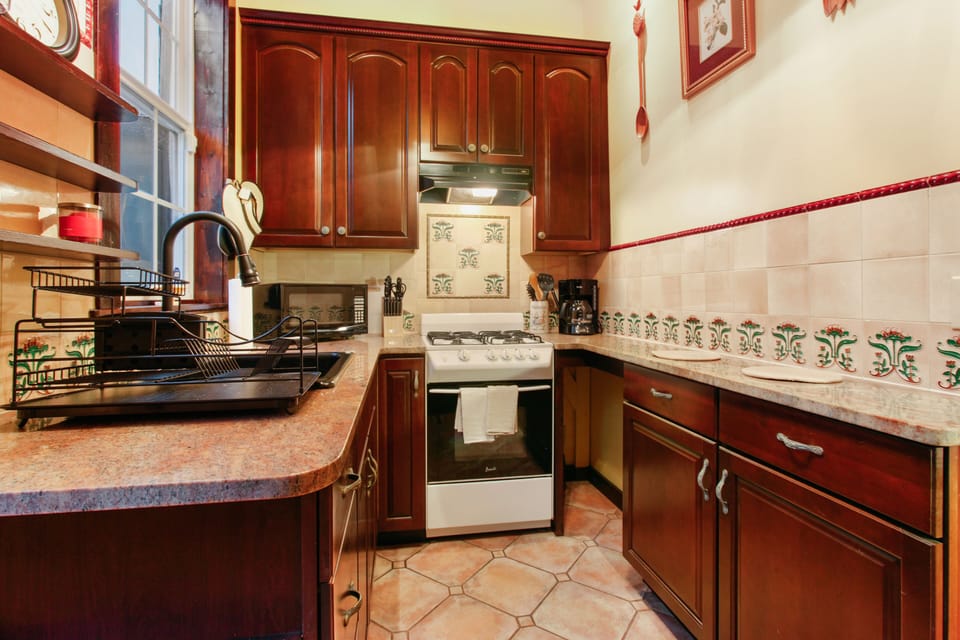 Lovely kitchen with granite counters and updated appliances. 