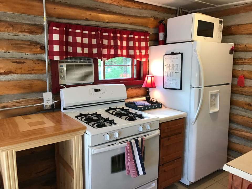 Gas range and oven with four burners, new pots, pans, utensils and necessities