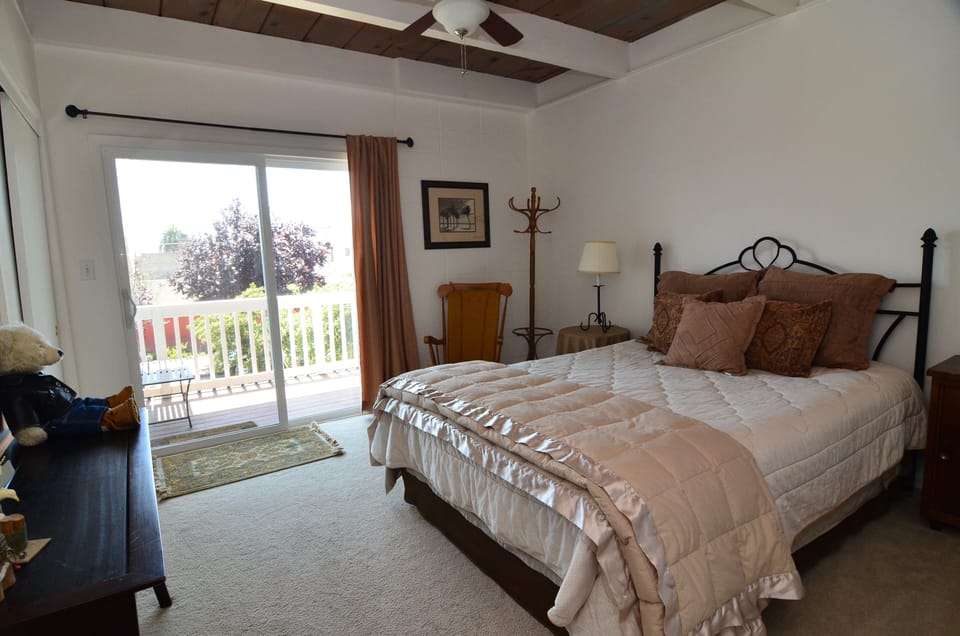 Queen size bed with upstairs deck.