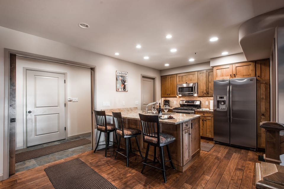 Kitchen area with mudroom and door leading to garag