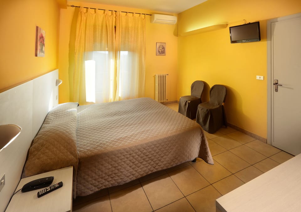 Economy Double or Twin Room | In-room safe, desk, free WiFi, bed sheets