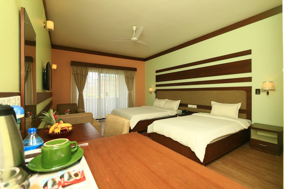 Deluxe Room | Bathroom | Shower, slippers, towels
