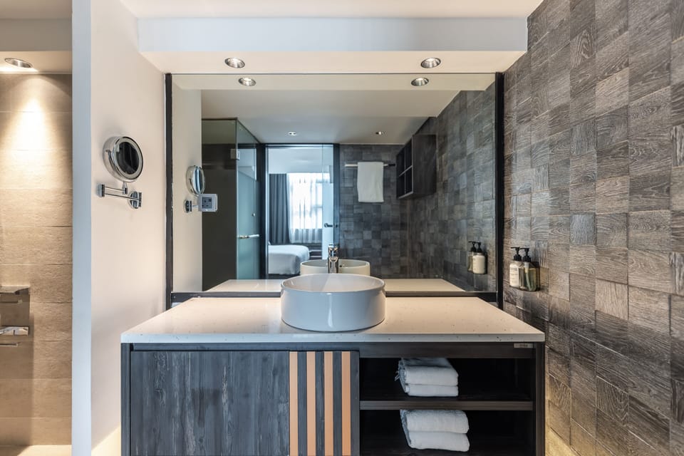 Separate tub and shower, rainfall showerhead, designer toiletries
