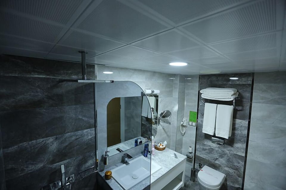 Shower, free toiletries, hair dryer, slippers