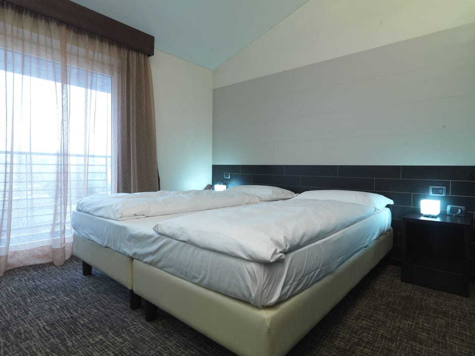 Down comforters, memory foam beds, in-room safe, desk