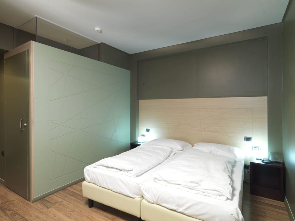 Down comforters, memory foam beds, in-room safe, desk