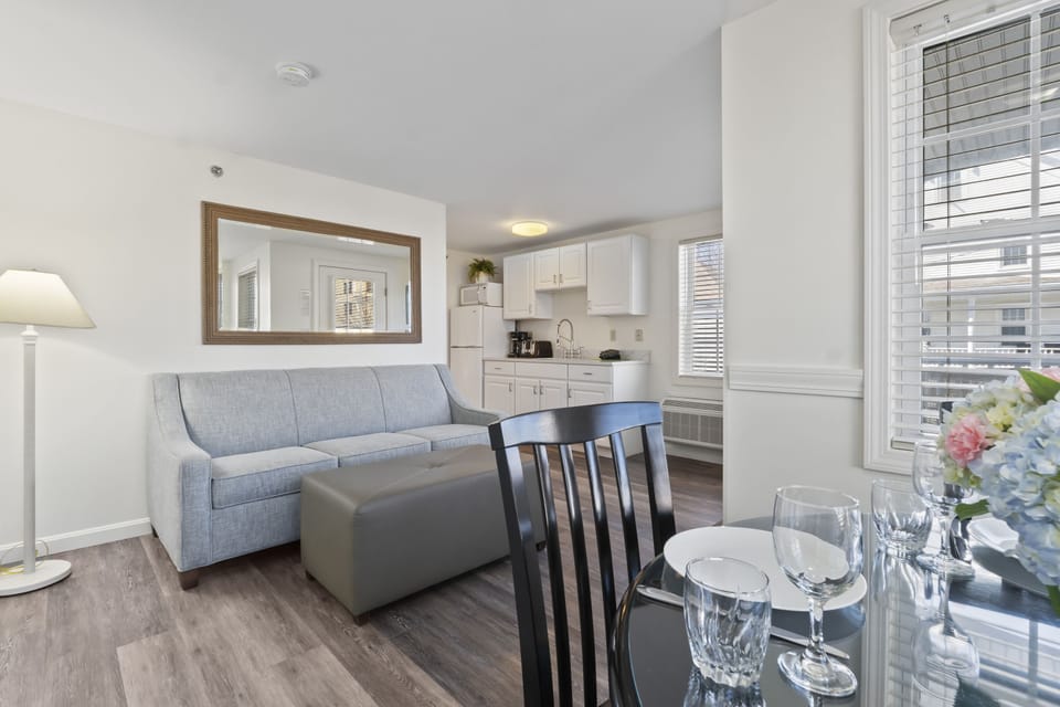 Suite, 1 Bedroom, Kitchenette, 1 King Bed OR 2 Queen Beds (Stairs Required) | Living area | Flat-screen TV