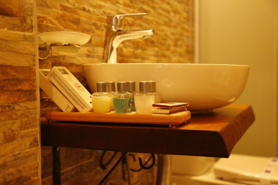 Shower, rainfall showerhead, designer toiletries, hair dryer
