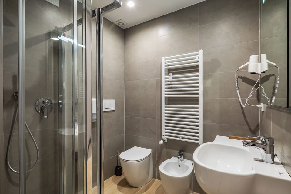 Shower, free toiletries, hair dryer, slippers