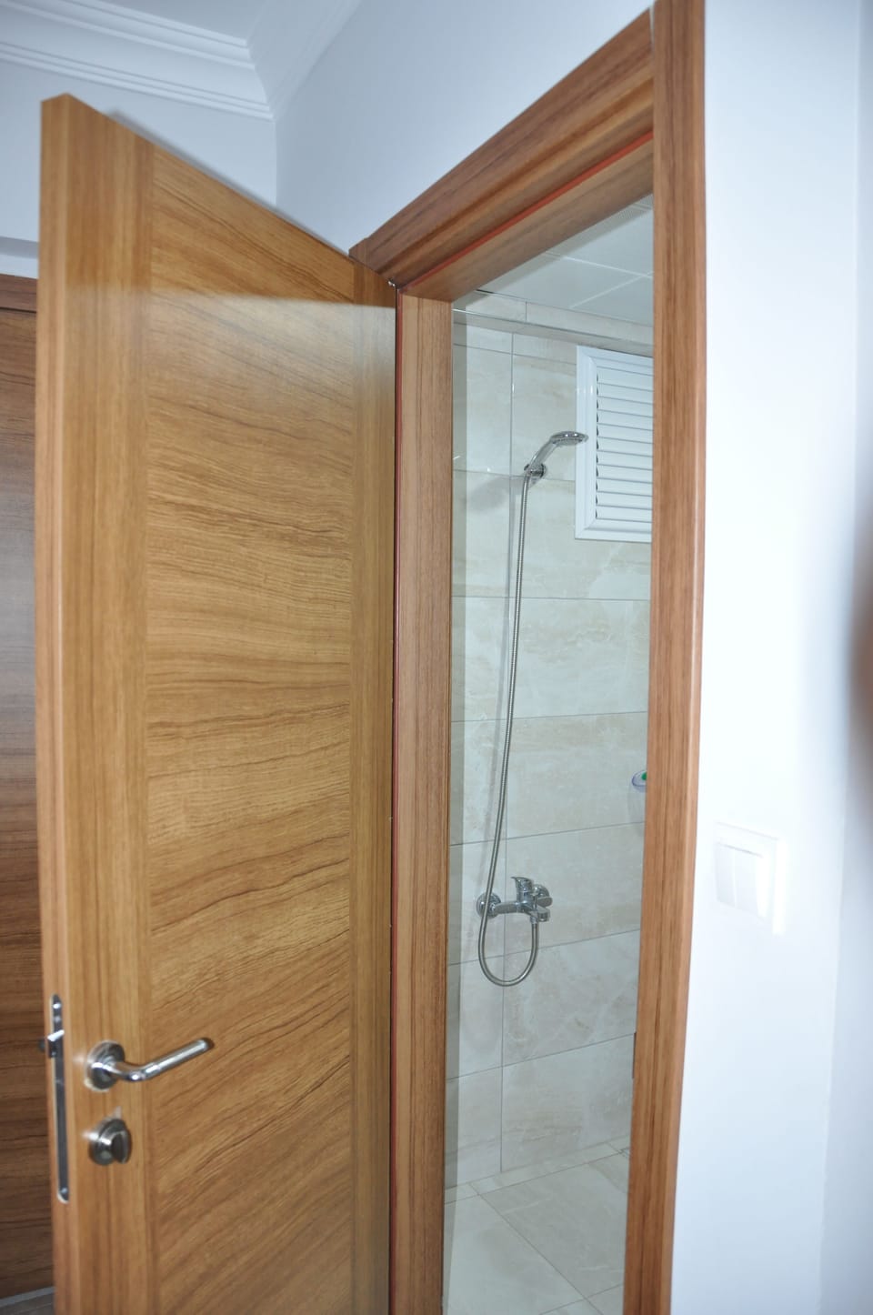 Shower, free toiletries, hair dryer, slippers