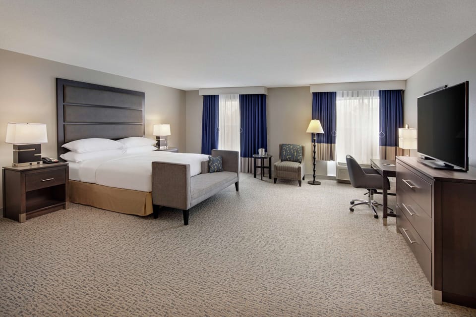 Room, 1 King Bed, Accessible (Roll-In Shower, Mobility & Hearing) | In-room safe, desk, laptop workspace, blackout drapes