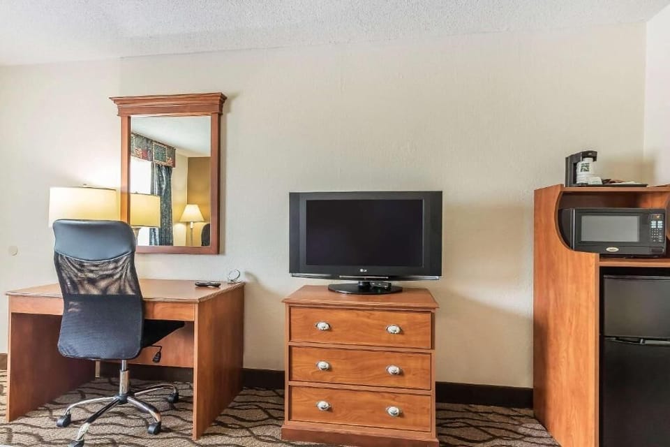 Desk, laptop workspace, blackout drapes, iron/ironing board