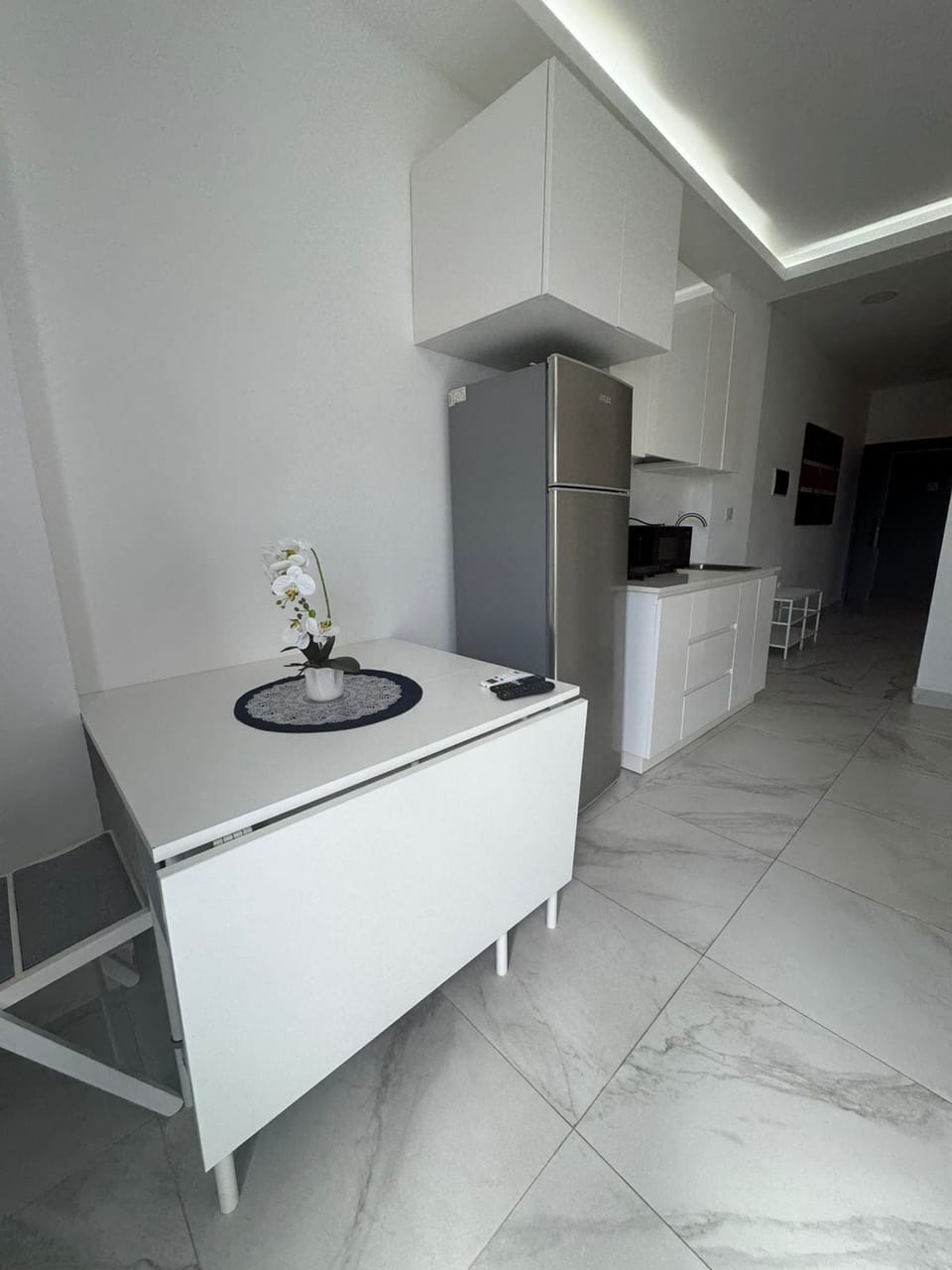 Elite Apartment | Living area | 32-inch TV with cable channels