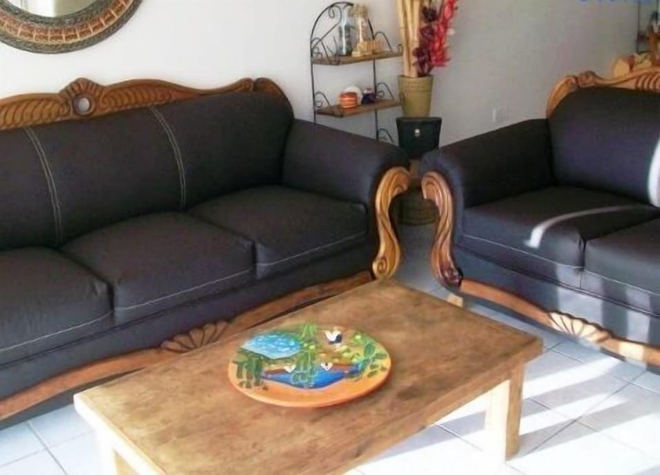 Family Condo, 2 Bedrooms, Ocean View, Beachfront | Living area | Flat-screen TV