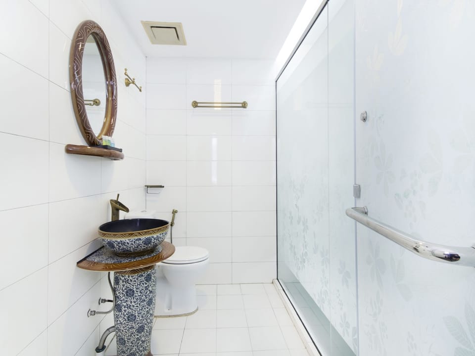 Bathroom | Shower, hair dryer, slippers, bidet