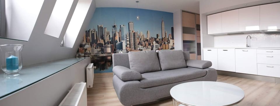City Studio Suite | Living area | Flat-screen TV