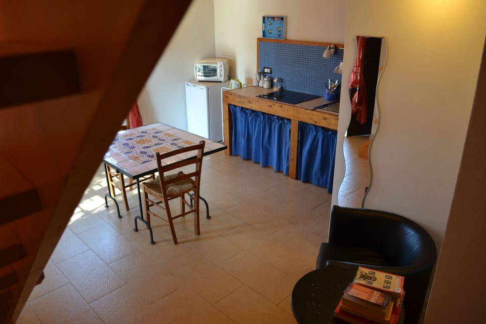 Deluxe Condo, Kitchenette | Living area | 21-inch LCD TV with digital channels, TV