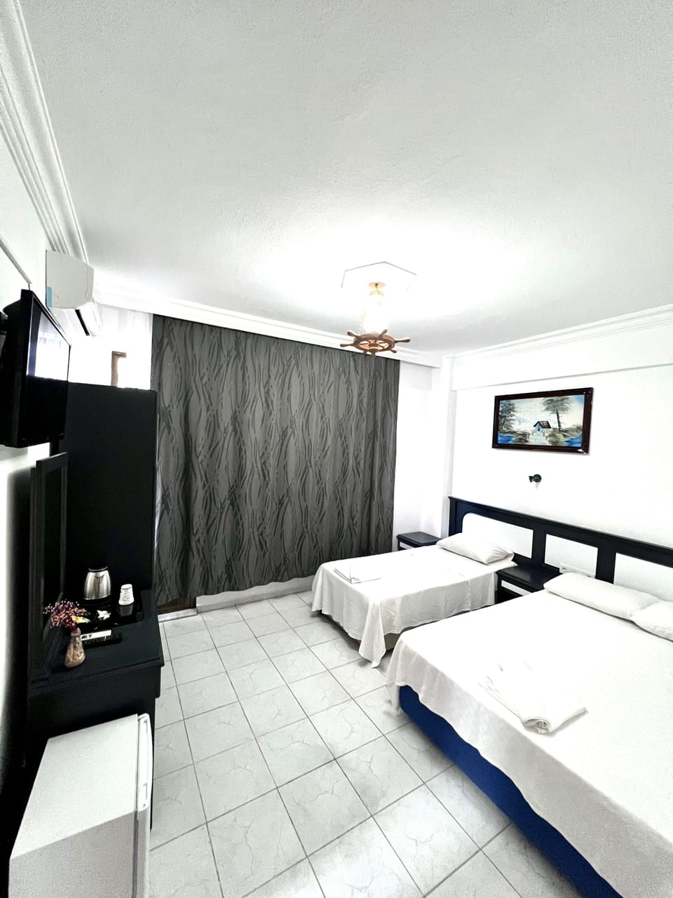 Standard Triple Room | Minibar, in-room safe, desk, soundproofing