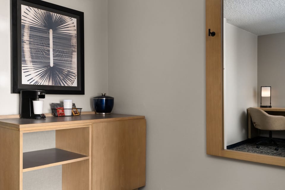 Premium bedding, desk, laptop workspace, blackout drapes