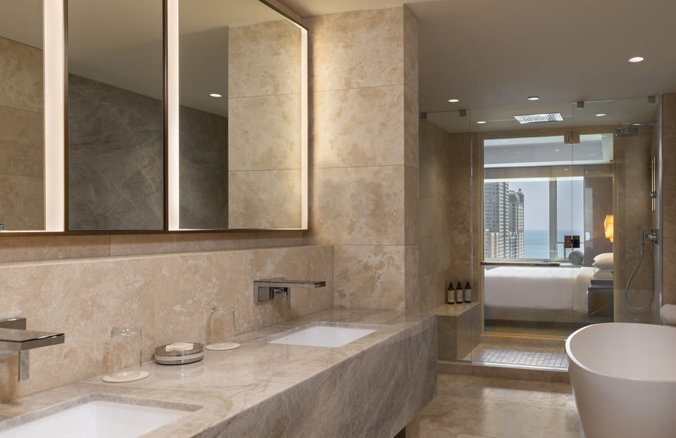 Presidential Suite | Bathroom | Designer toiletries, hair dryer, bathrobes, slippers