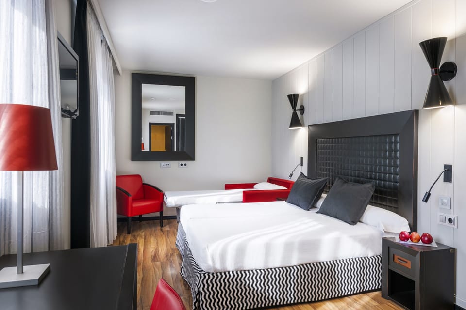 Triple room with Spa access | Minibar, in-room safe, desk, blackout drapes