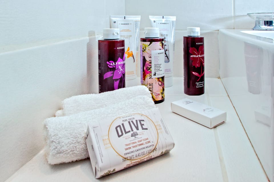 Family Room, Sea View | Bathroom amenities | Rainfall showerhead, designer toiletries, hair dryer, towels