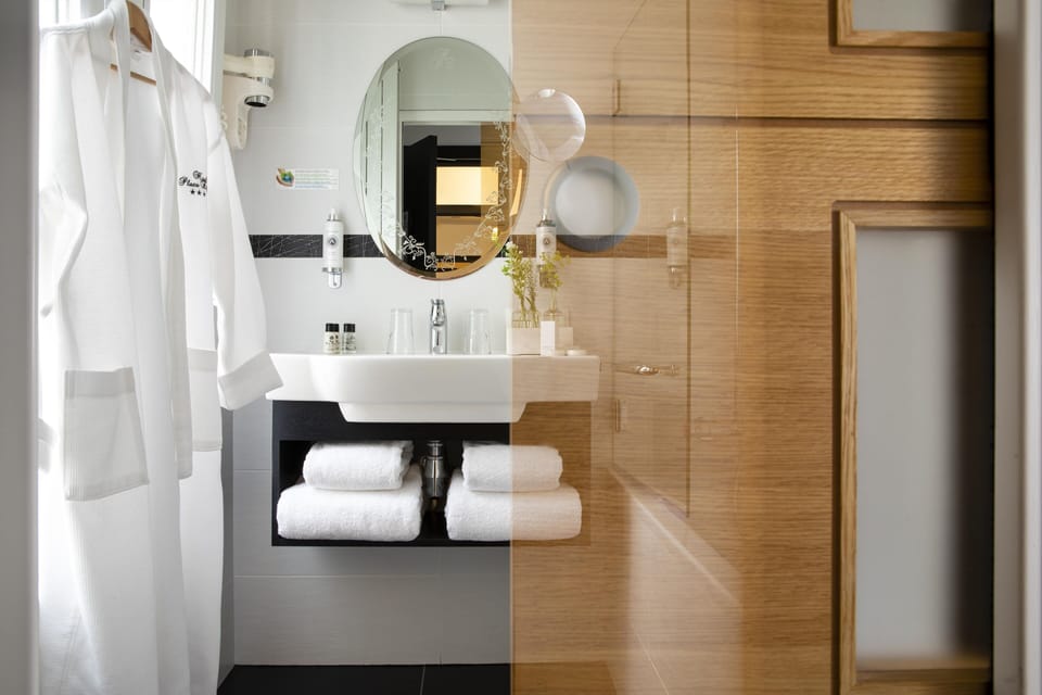 Superior Double Room | Bathroom | Combined shower/tub, deep soaking tub, hair dryer, bathrobes