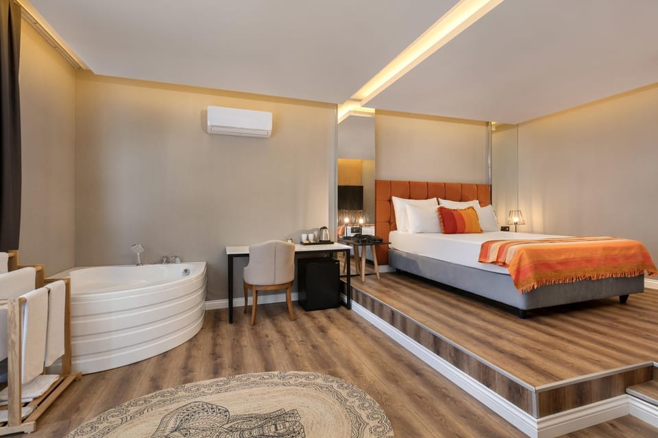 Junior Suite, Jetted Tub | Premium bedding, minibar, in-room safe, free WiFi