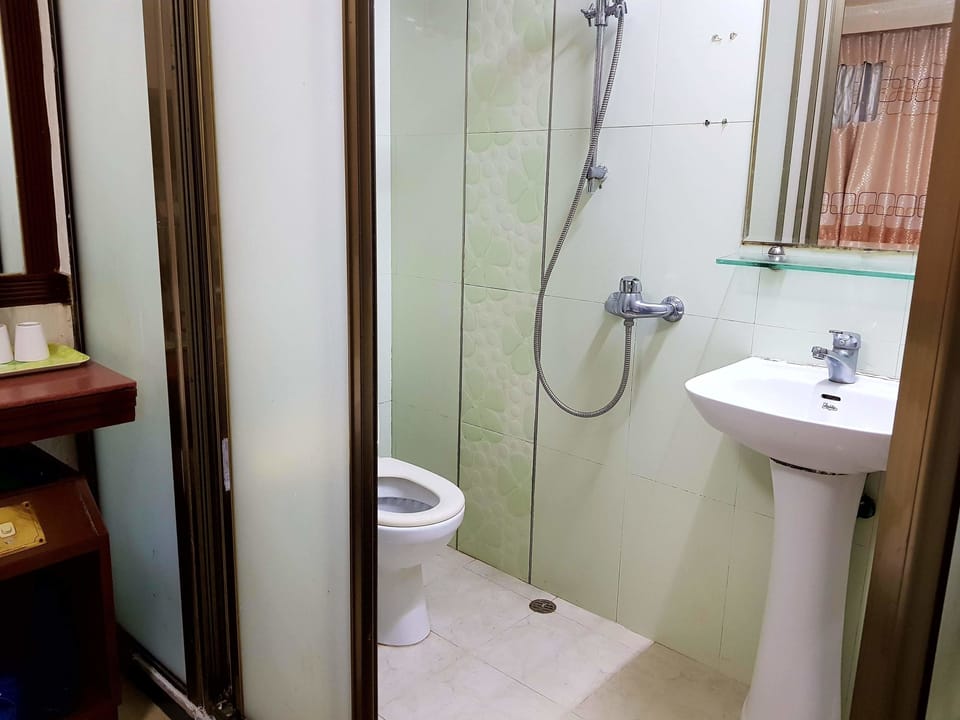 Shower, free toiletries, hair dryer, slippers
