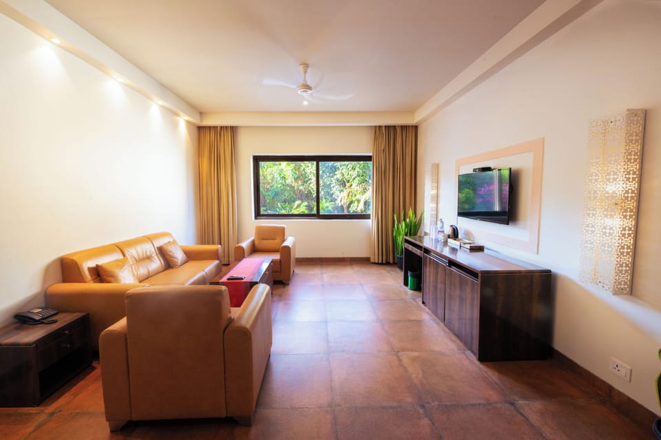 Suite, Smoking, Pool View | Living room | Flat-screen TV