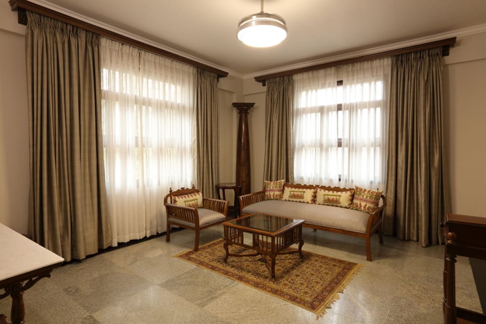 Millennium Suite | Living area | 43-inch flat-screen TV with satellite channels, TV