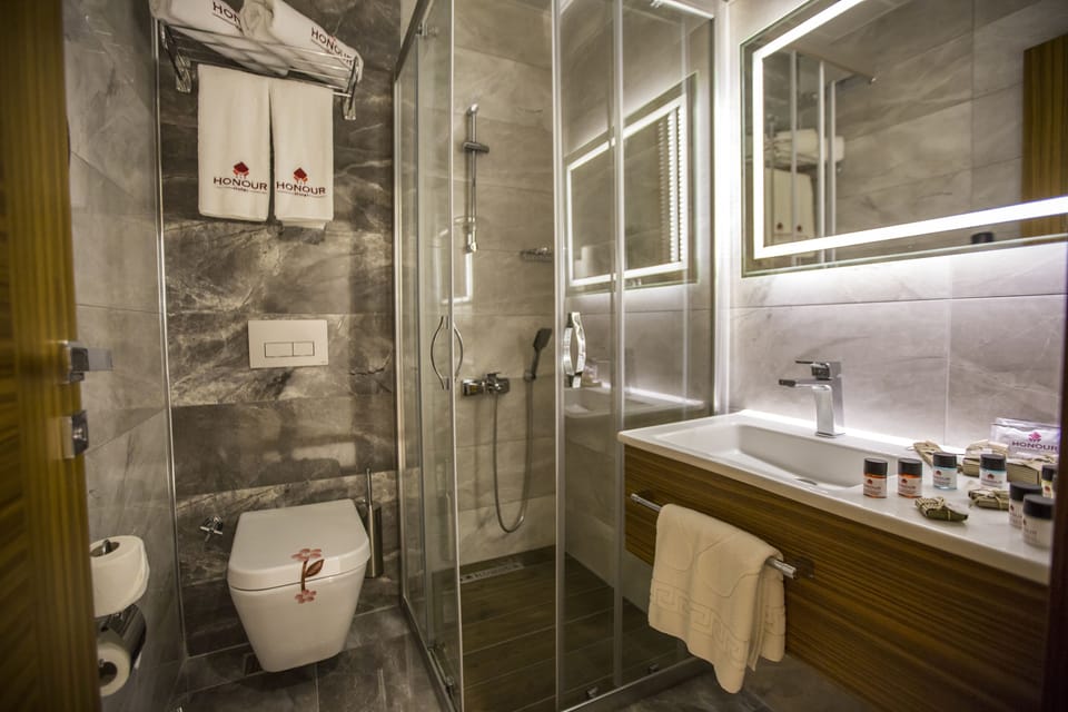 Shower, free toiletries, hair dryer, slippers