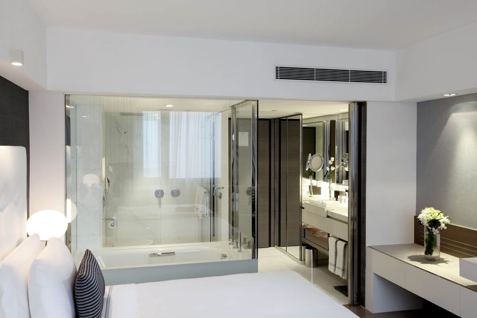 Designer toiletries, hair dryer, bathrobes, slippers