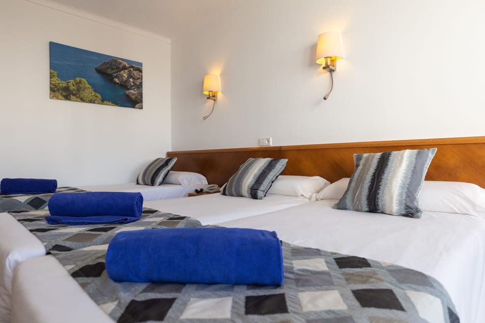 Triple Room | Desk, blackout drapes, WiFi (surcharge), bed sheets