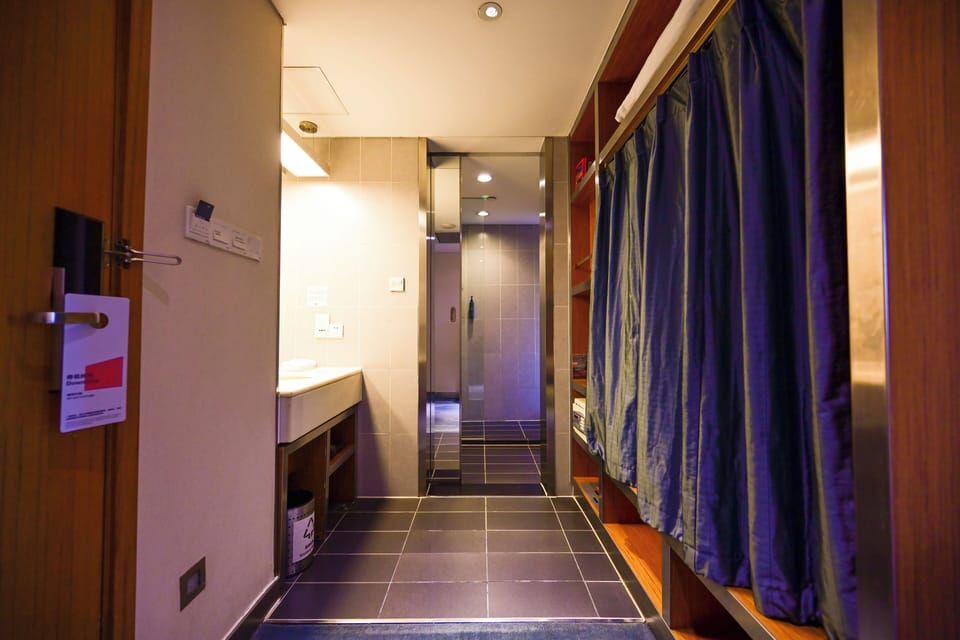Shower, rainfall showerhead, designer toiletries, hair dryer