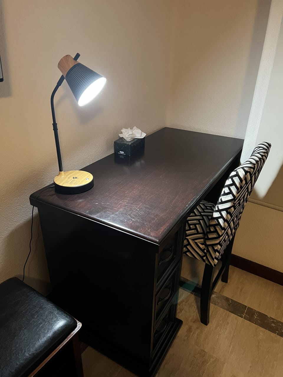 Desk in the master bedroom for conducting business or pleasure.