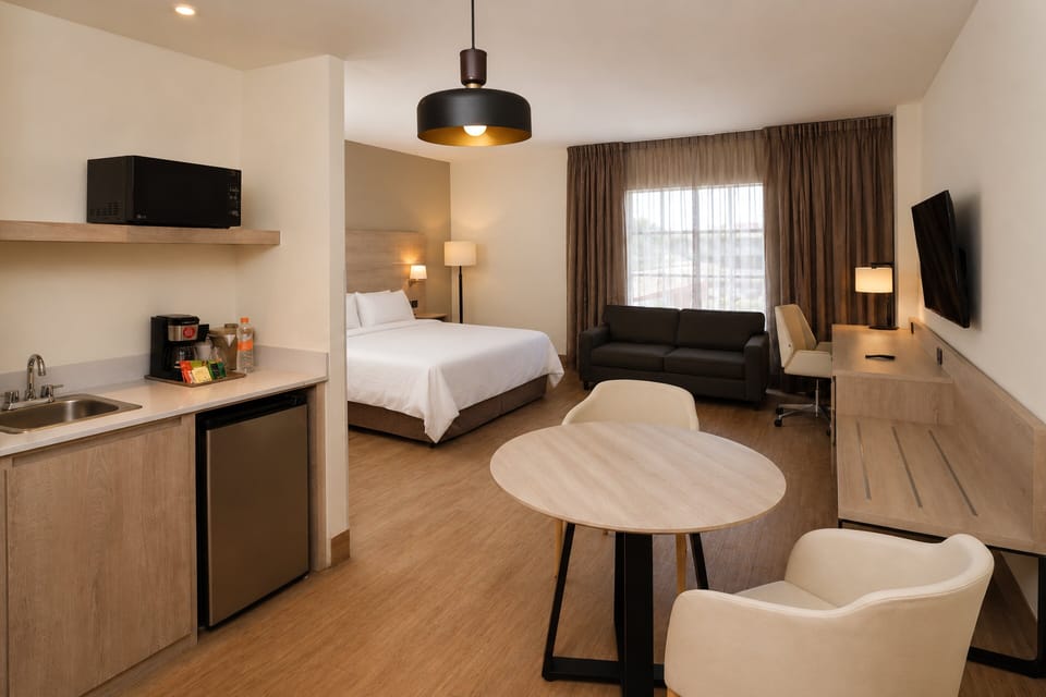 Suite, 1 King Bed | In-room safe, desk, iron/ironing board, cribs (free)