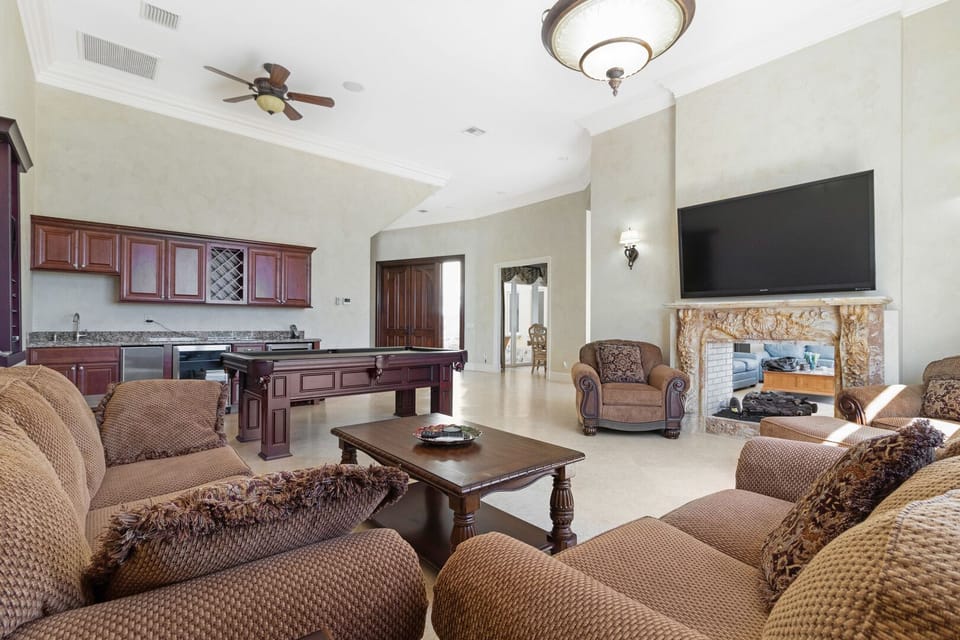 Enjoy the wet bar and pool table, compete with beverage coolers and ice maker 
