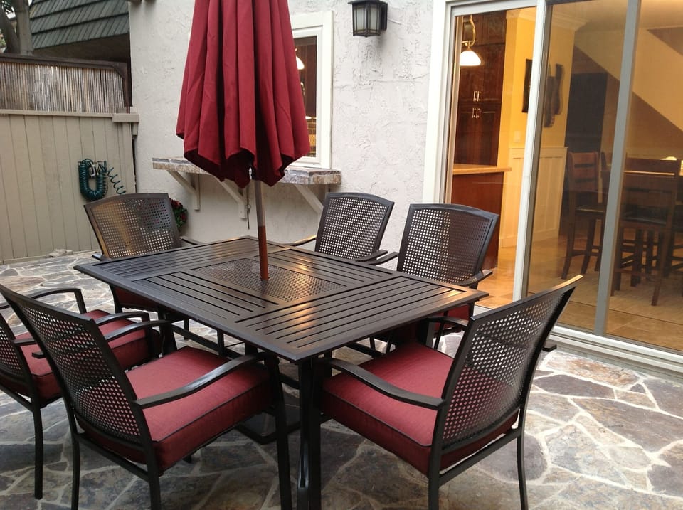 Private Patio features seating for 6, Kitchen passthru and private gate